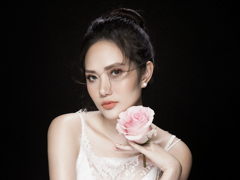 Hoa hậu Diệu Linh khoe vẻ gợi cảm bên hoa hồng