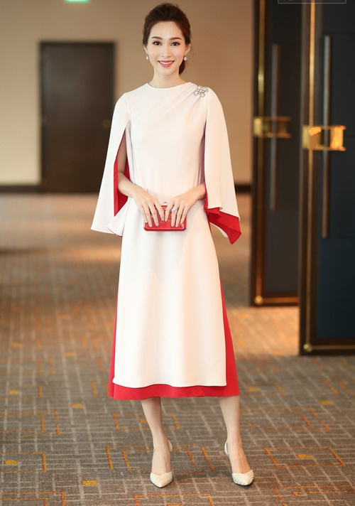 Trước khi bước lên xe hoa về nhà chồng, Hoa hậu Đặng Thu Thảo vẫn đẹp nức lòng trong thiết kế váy dáng cape thanh lịch, quý phái 